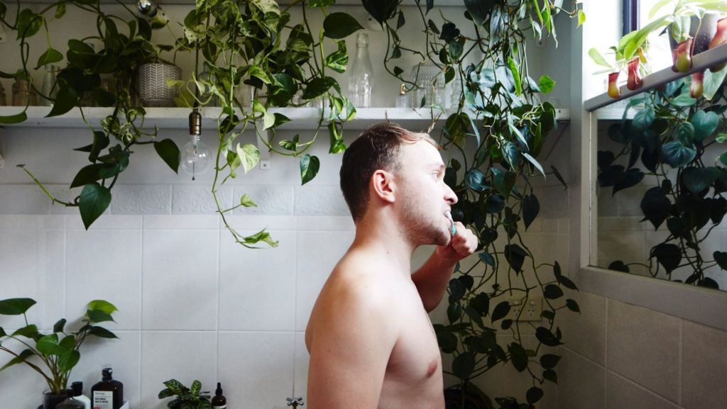 Man with his house plants